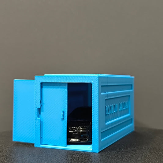 babakék színű hot wheels kisautó garázs