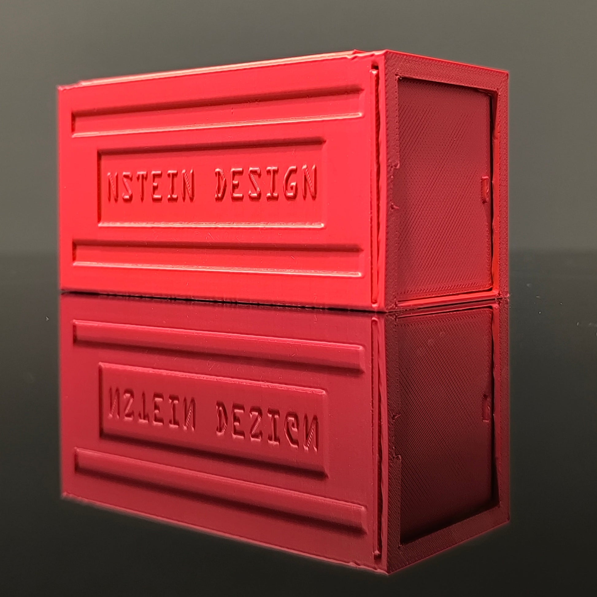 piros színű hot wheels kisautó garázs