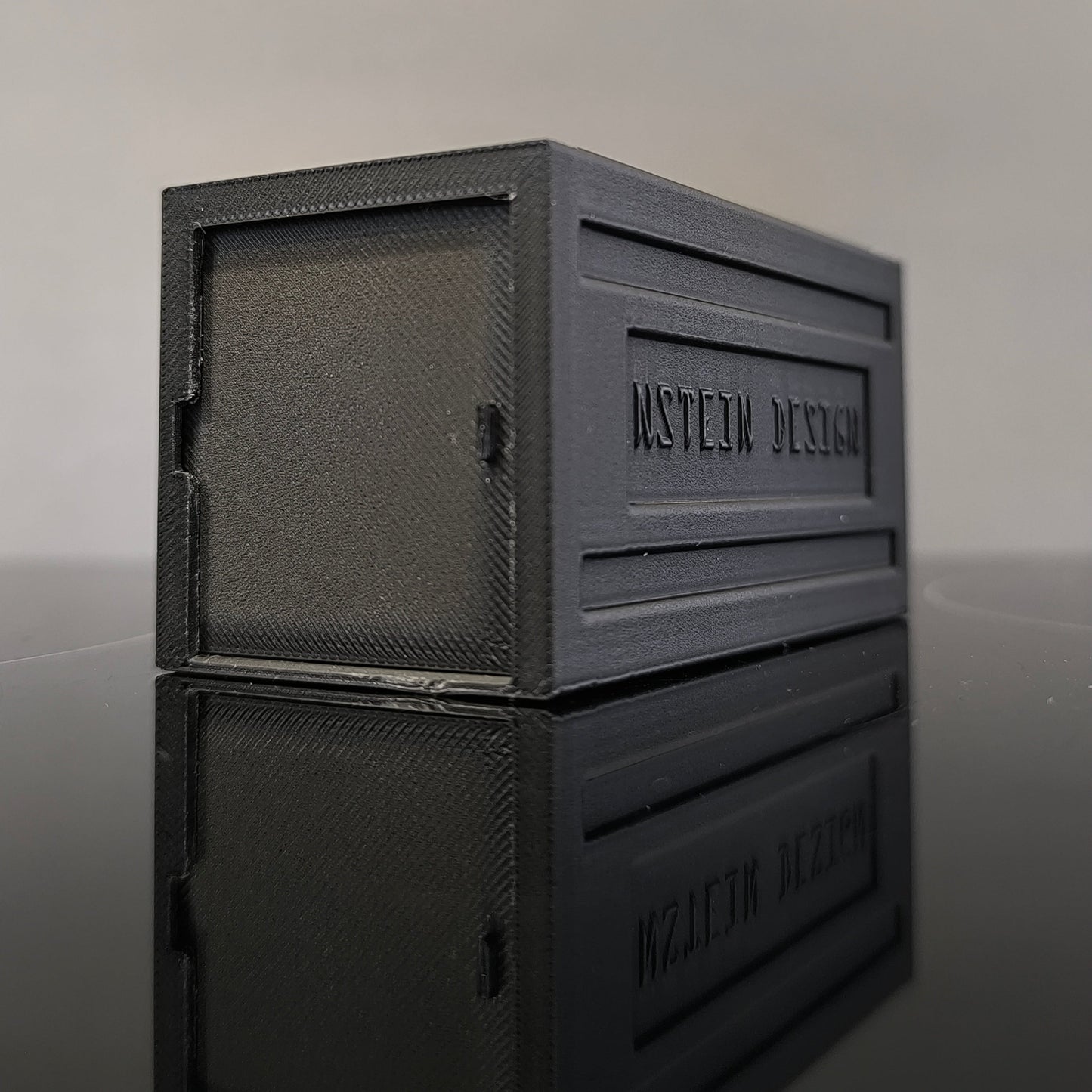 fekete színű hot wheels kisautó garázs