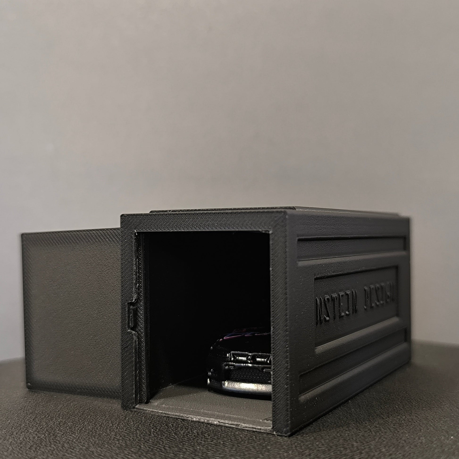 fekete színű hot wheels kisautó garázs