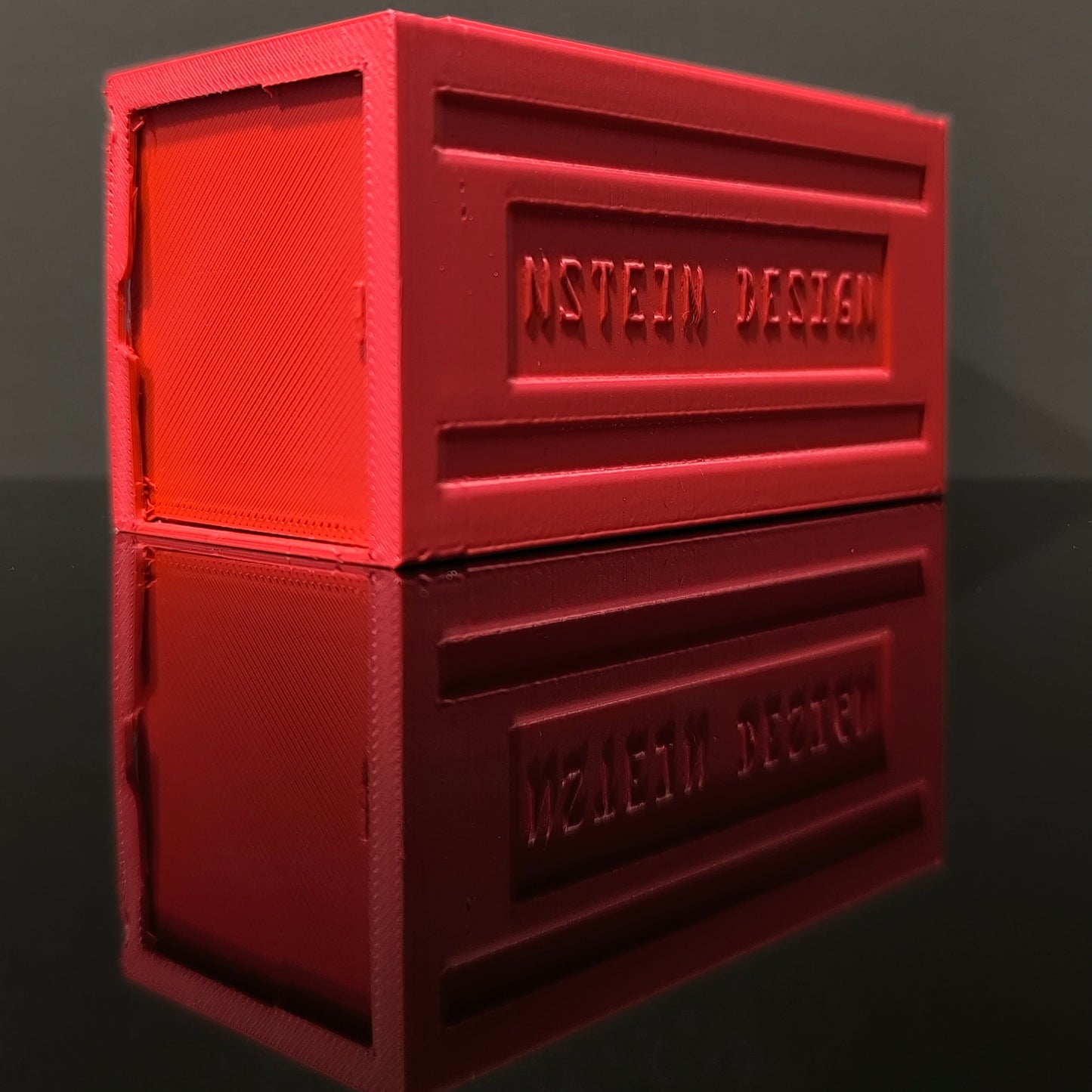 Piros színű hot wheels kisautó garázs